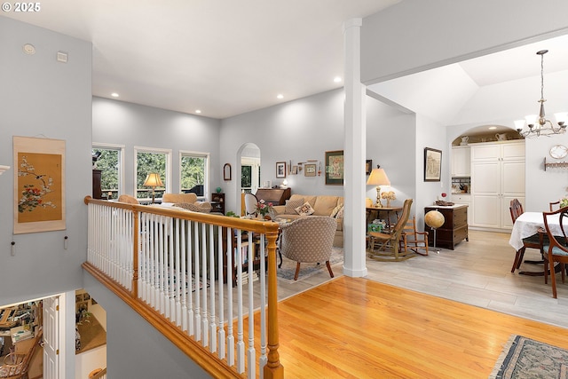 161 Single Pine Ln, Winchester, OR 97495 - living room featuring arched walkways, a chandelier, light wood-style flooring, and recessed lighting
