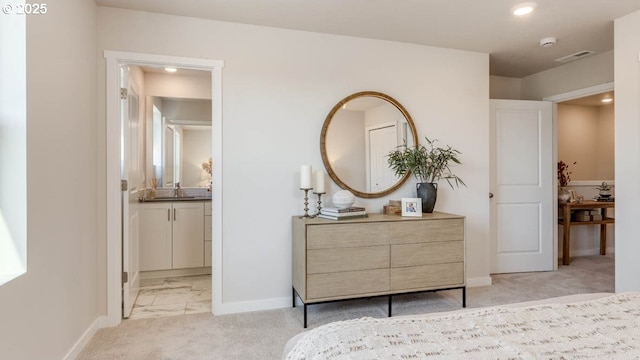 6558 SE Nasha St, Hillsboro, OR 97123 - bedroom featuring baseboards, recessed lighting, ensuite bathroom, light colored carpet, and light marble finish floors