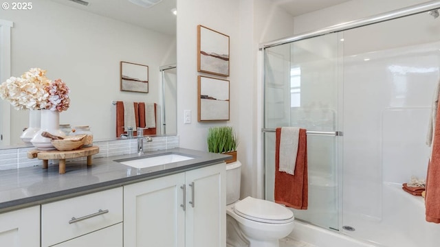 6558 SE Nasha St, Hillsboro, OR 97123 - bathroom with vanity, a stall shower, and toilet