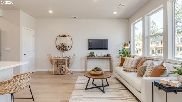 6558 SE Nasha St, Hillsboro, OR 97123 - living room with light wood-style floors, recessed lighting, and baseboards