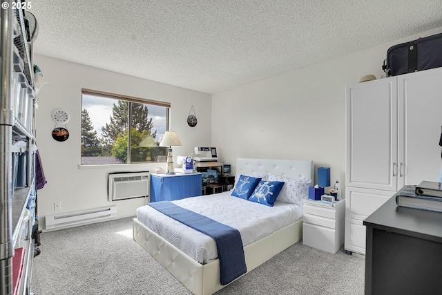 12160 SW Royal Ct Unit D, Portland, OR 97224 - bedroom featuring a baseboard heating unit, light carpet, a wall unit AC, and a textured ceiling