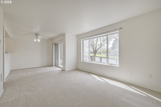 7197 SW Sagert St Unit 103, Tualatin, OR 97062 - unfurnished room featuring light carpet, a ceiling fan, and baseboards