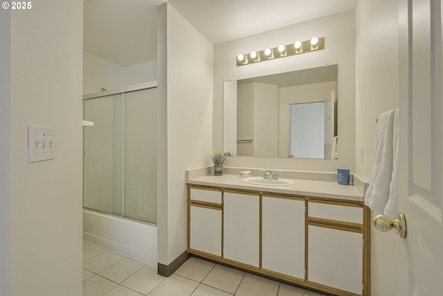7197 SW Sagert St Unit 103, Tualatin, OR 97062 - full bath featuring tile patterned flooring, vanity, and combined bath / shower with glass door