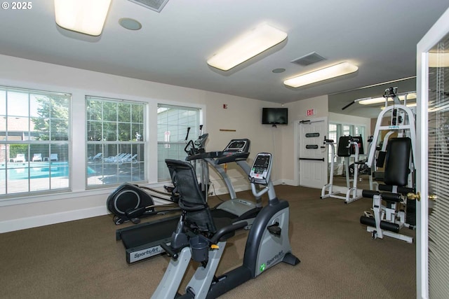 7197 SW Sagert St Unit 103, Tualatin, OR 97062 - exercise room featuring baseboards and carpet