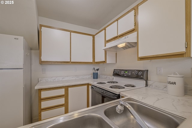 7197 SW Sagert St Unit 103, Tualatin, OR 97062 - kitchen featuring under cabinet range hood, electric stove, freestanding refrigerator, light countertops, and a sink