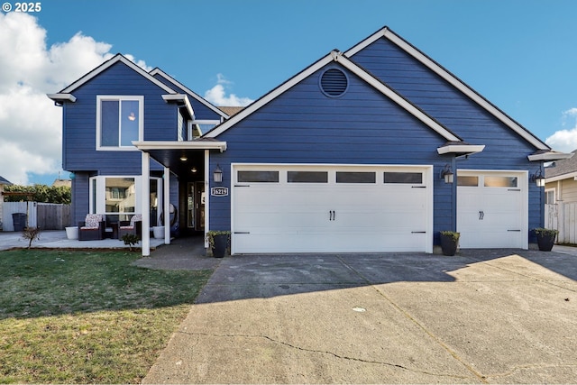 view of front of home with a garage and a front lawn