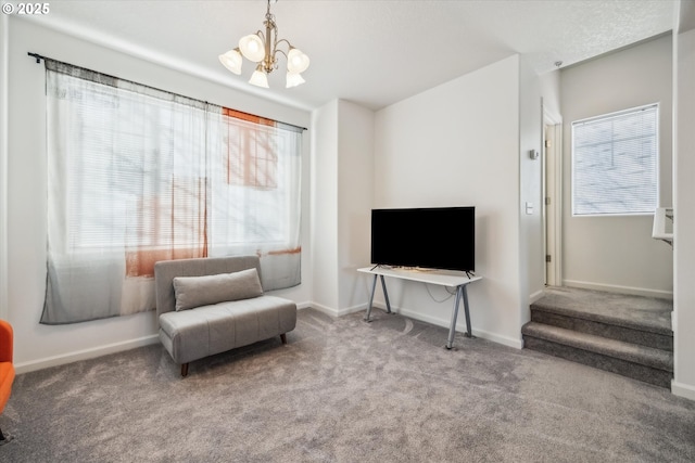 living area featuring carpet flooring and a wealth of natural light