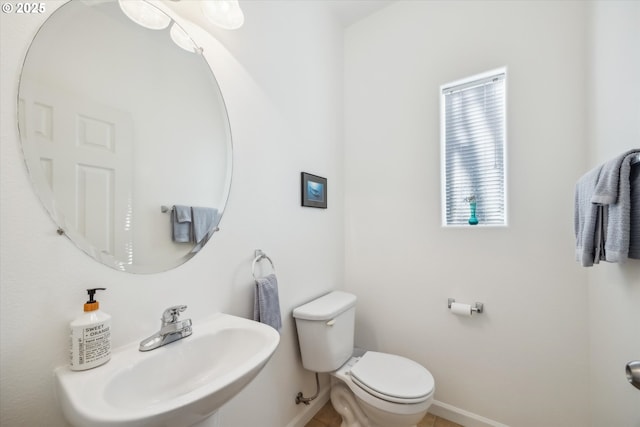 bathroom featuring sink and toilet