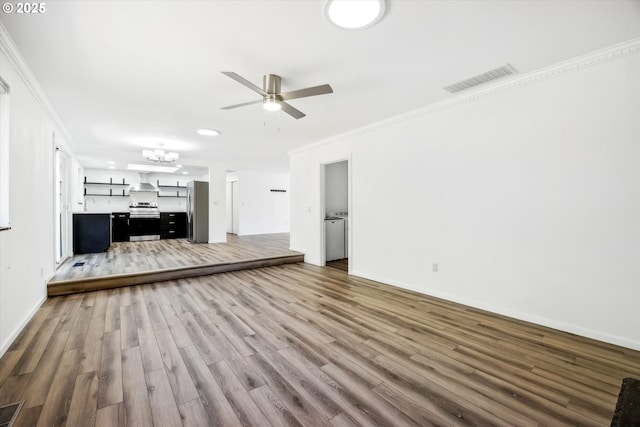 1630 SW Kings Byway, Troutdale, OR 97060 - unfurnished living room with ceiling fan, wood finished floors, crown molding, a chandelier, and baseboards