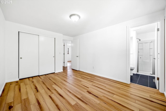 1630 SW Kings Byway, Troutdale, OR 97060 - unfurnished bedroom with light wood finished floors, a closet, baseboards, and connected bathroom