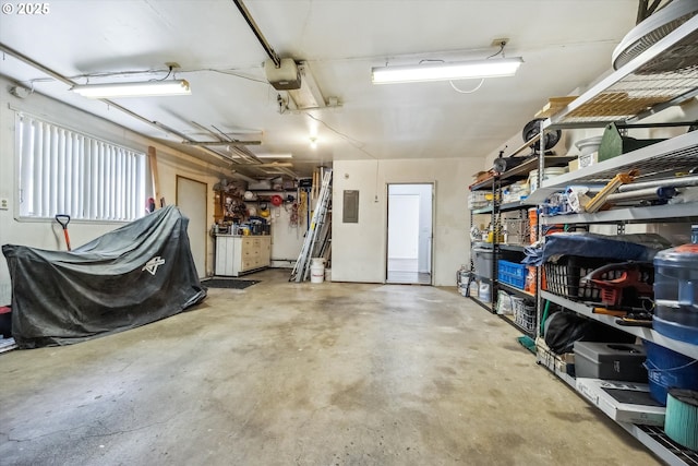 1630 SW Kings Byway, Troutdale, OR 97060 - garage with electric panel, a workshop area, and a garage door opener