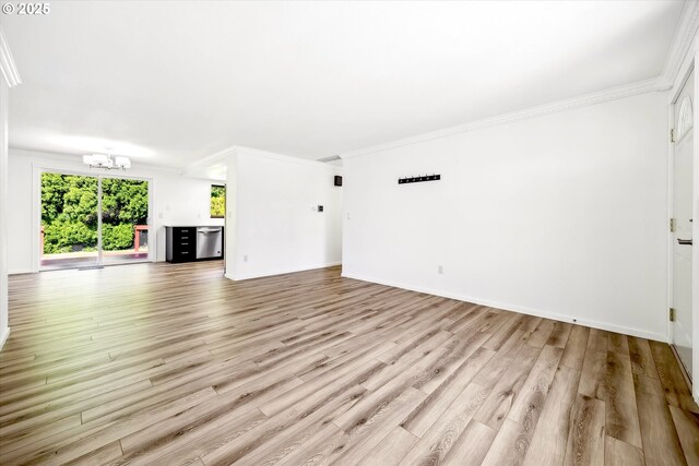 1630 SW Kings Byway, Troutdale, OR 97060 - unfurnished living room with a chandelier, plenty of natural light, light wood finished floors, crown molding, and baseboards