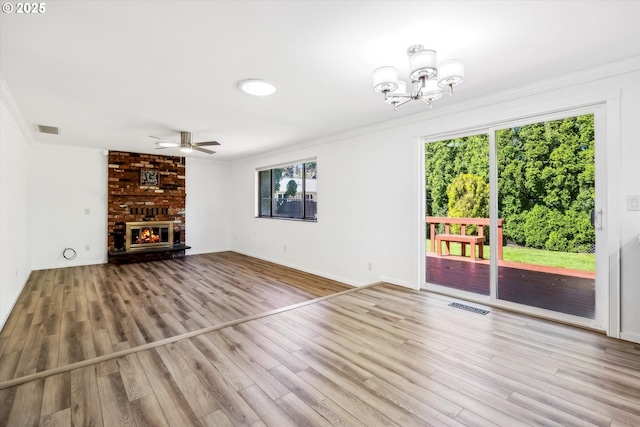 1630 SW Kings Byway, Troutdale, OR 97060 - unfurnished living room featuring ornamental molding, healthy amount of natural light, a ceiling fan, and wood finished floors