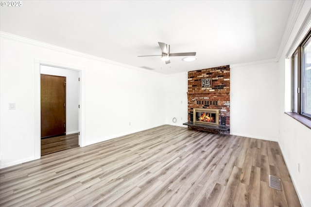 1630 SW Kings Byway, Troutdale, OR 97060 - unfurnished living room with ornamental molding, ceiling fan, wood finished floors, a fireplace, and baseboards