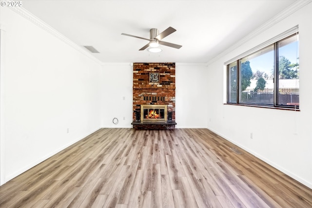 1630 SW Kings Byway, Troutdale, OR 97060 - unfurnished living room featuring a ceiling fan, crown molding, wood finished floors, a brick fireplace, and baseboards