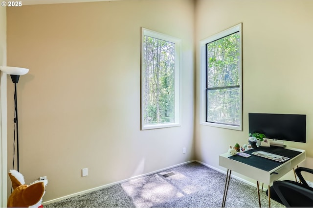 home office with carpet floors, baseboards, and visible vents