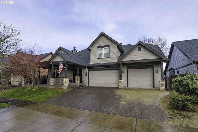 craftsman-style home featuring driveway, stone siding, roof with shingles, and an attached garage