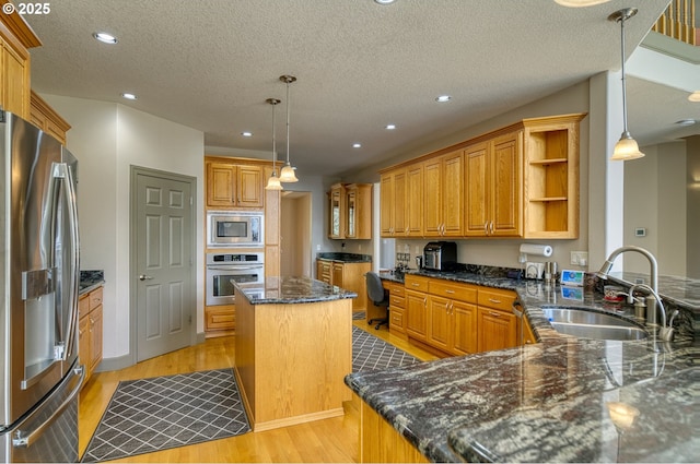 kitchen with open shelves, a textured ceiling, a sink, light wood finished floors, and stainless steel appliances