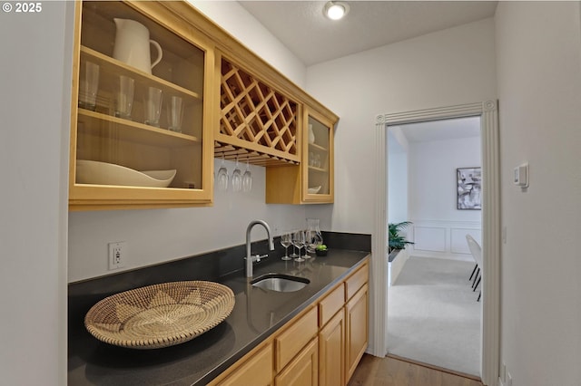 15017 SW Telluride Ter, Beaverton, OR 97007 - bar featuring light wood-style floors, wainscoting, and a decorative wall