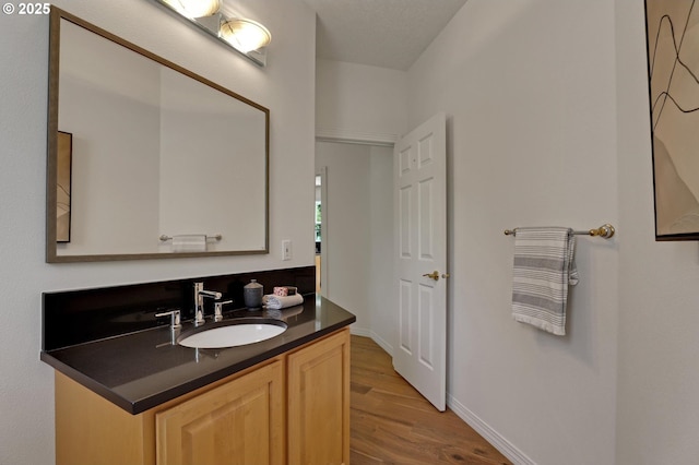15017 SW Telluride Ter, Beaverton, OR 97007 - bathroom featuring wood finished floors and vanity