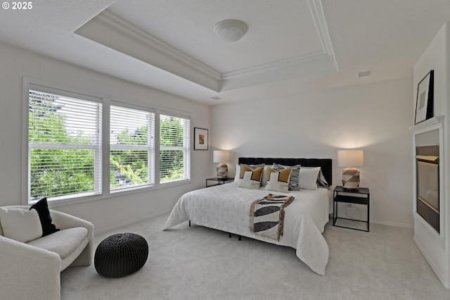15017 SW Telluride Ter, Beaverton, OR 97007 - bedroom featuring a raised ceiling, light carpet, and crown molding