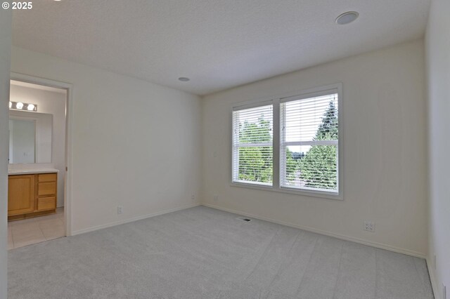 15017 SW Telluride Ter, Beaverton, OR 97007 - unfurnished bedroom featuring light carpet and ensuite bathroom