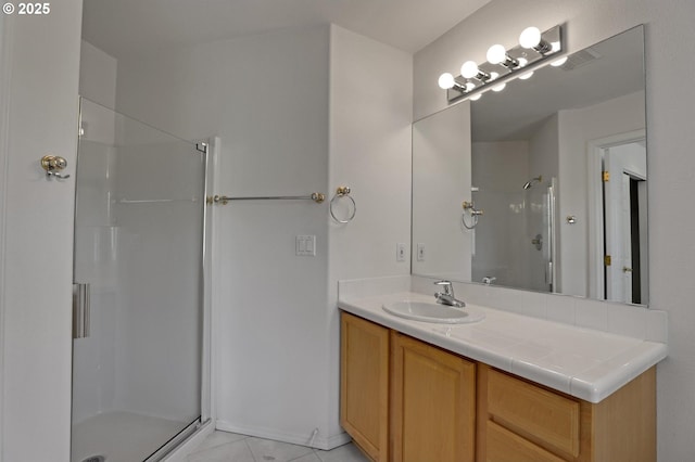 15017 SW Telluride Ter, Beaverton, OR 97007 - bathroom featuring a stall shower, vanity, and tile patterned floors