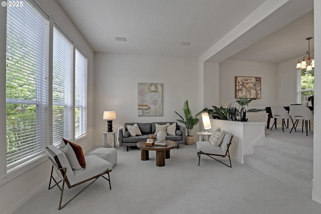 15017 SW Telluride Ter, Beaverton, OR 97007 - living room with a chandelier and carpet floors