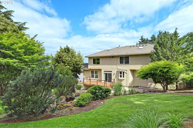 15017 SW Telluride Ter, Beaverton, OR 97007 - rear view of property with a deck and a yard
