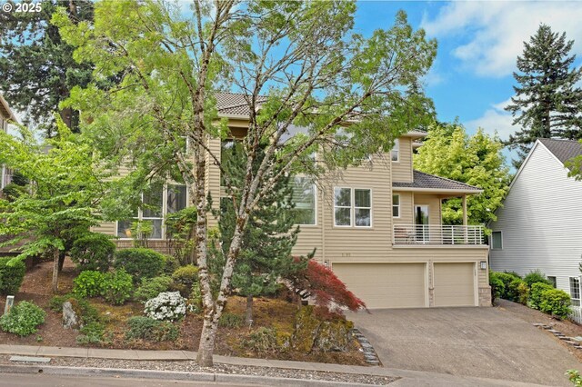 15017 SW Telluride Ter, Beaverton, OR 97007 - view of front of property featuring an attached garage, driveway, and a balcony