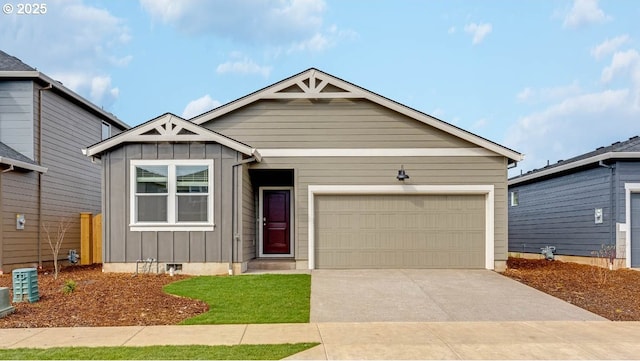2906 U St, Springfield, OR 97477 - view of front of house featuring board and batten siding, driveway, crawl space, and a garage