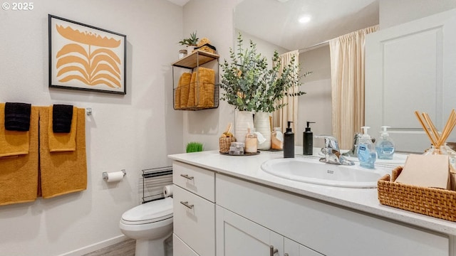 2906 U St, Springfield, OR 97477 - full bath with vanity, toilet, baseboards, wood finished floors, and curtained shower