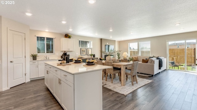 2906 U St, Springfield, OR 97477 - kitchen featuring dark wood-style floors, white cabinetry, a center island, open floor plan, and recessed lighting