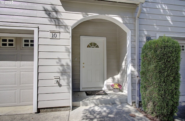 property entrance featuring a garage