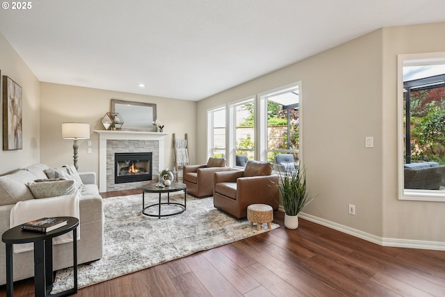 7330 SW Kelsi Ct, Portland, OR 97223 - living area with a stone fireplace, baseboards, plenty of natural light, wood finished floors, and recessed lighting