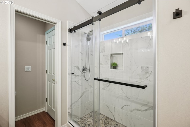 7330 SW Kelsi Ct, Portland, OR 97223 - full bathroom with a marble finish shower, wood finished floors, and baseboards