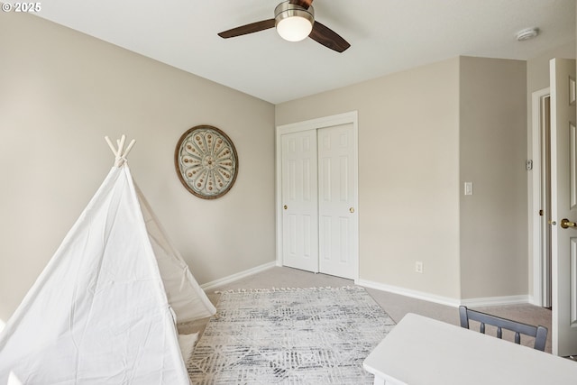 7330 SW Kelsi Ct, Portland, OR 97223 - bedroom with light colored carpet, a closet, baseboards, and a ceiling fan