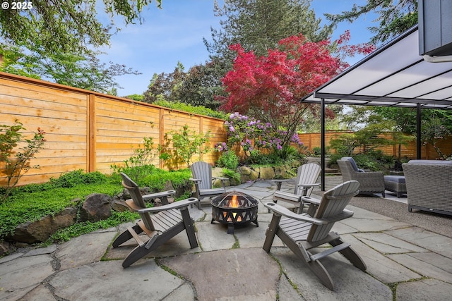 7330 SW Kelsi Ct, Portland, OR 97223 - fenced backyard featuring a fire pit and a patio area
