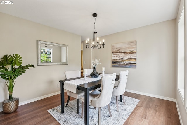 7330 SW Kelsi Ct, Portland, OR 97223 - dining room with a chandelier, wood finished floors, and baseboards