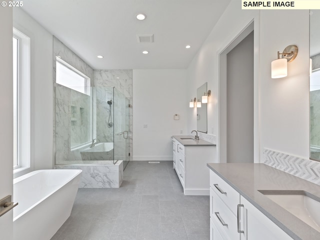 15012 NW 13th Ave, Vancouver, WA 98685 - full bathroom with a marble finish shower, visible vents, two vanities, a freestanding bath, and a sink