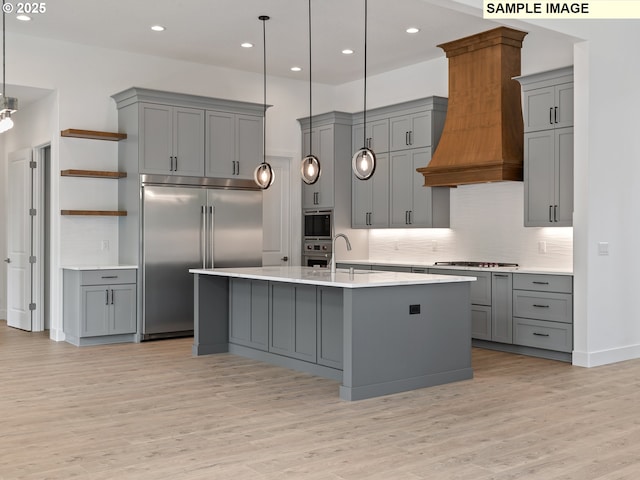 15012 NW 13th Ave, Vancouver, WA 98685 - kitchen with pendant lighting, gray cabinets, light countertops, custom range hood, and built in appliances