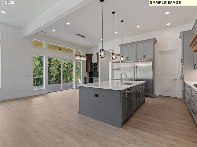 15012 NW 13th Ave, Vancouver, WA 98685 - kitchen featuring a spacious island, gray cabinets, hanging light fixtures, and open floor plan