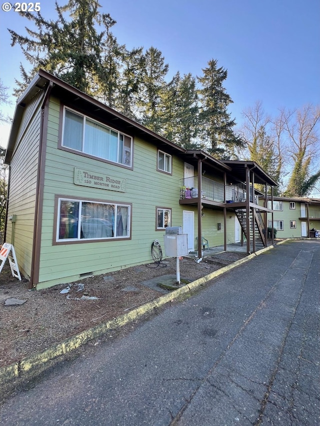 exterior space featuring stairway and crawl space