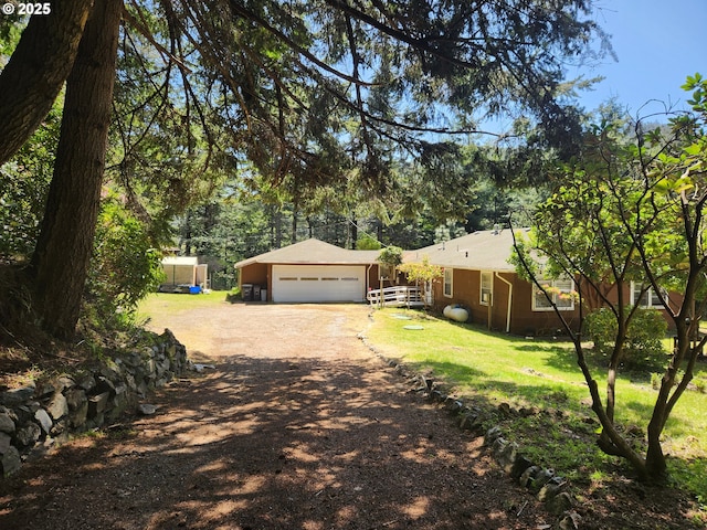 28213 Hunter Creek Hts, Gold Beach, OR 97444 - exterior space with a front lawn, driveway, and an attached garage