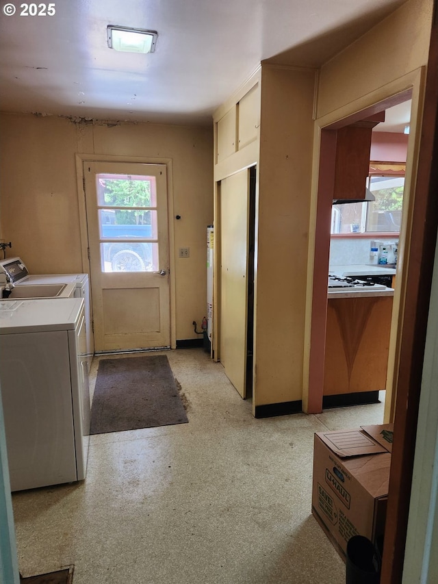 28213 Hunter Creek Hts, Gold Beach, OR 97444 - washroom featuring washing machine and clothes dryer, water heater, laundry area, and a healthy amount of sunlight