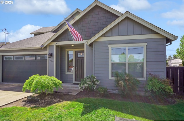 1522 NE Sunrise Ln, Hillsboro, OR 97124 - craftsman-style home featuring a garage, a front lawn, fence, board and batten siding, and concrete driveway
