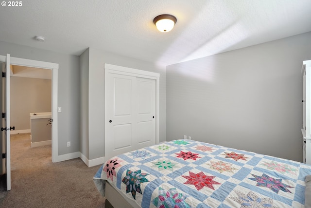 1522 NE Sunrise Ln, Hillsboro, OR 97124 - bedroom featuring baseboards, a textured ceiling, carpet, and a closet