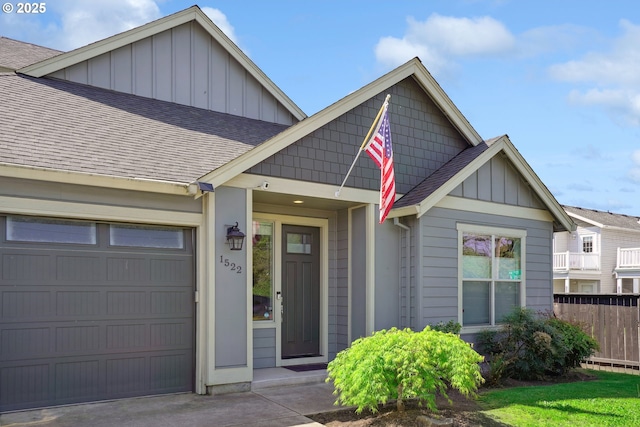 1522 NE Sunrise Ln, Hillsboro, OR 97124 - craftsman house with fence, board and batten siding, a shingled roof, and a garage