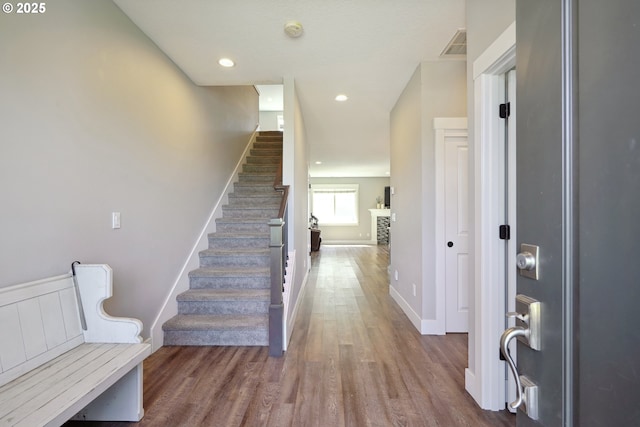 1522 NE Sunrise Ln, Hillsboro, OR 97124 - entryway with visible vents, wood finished floors, baseboards, stairway, and recessed lighting