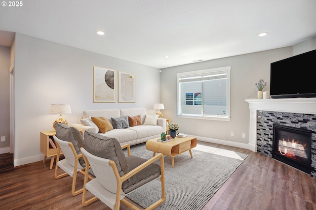 1522 NE Sunrise Ln, Hillsboro, OR 97124 - living room with baseboards, recessed lighting, a glass covered fireplace, and wood finished floors